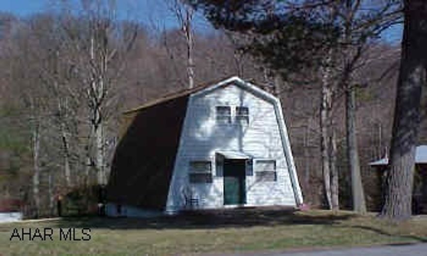 Nice A-Frame home located in peaseful country setting. Year round stream located on property. First level offers a living room, kitchen, and full bath. Second level contains two bedrooms and a storage area. Partial finished basement with bath, bedroom, and walkout door. Can be used for year round living or recreational use. Appts M-F after 5:00pm. Anytime weekends.