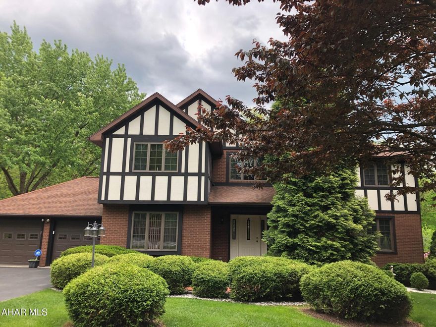 Welcome to this stunning 4-bedroom, 4-bathroom Tudor-style home, offering 4500 sq ft of elegant living space in Sylvan East. This two-story gem blends classic architectural details with modern comforts, featuring spacious interiors, rich hardwood flooring and abundant natural light throughout. 
The main floor boasts a gracious living room, a formal dining room perfect for entertaining and a thoughtfully designed kitchen with ample storage and prep space, along with a cozy family room with a gas fireplace, and a home office. Upstairs you will find generously sized bedrooms, including a luxurious primary suite with a spa-like bath.
The fully finished basement provides even more room to relax or entertain - ideal for a media room, gym, or guest suite.