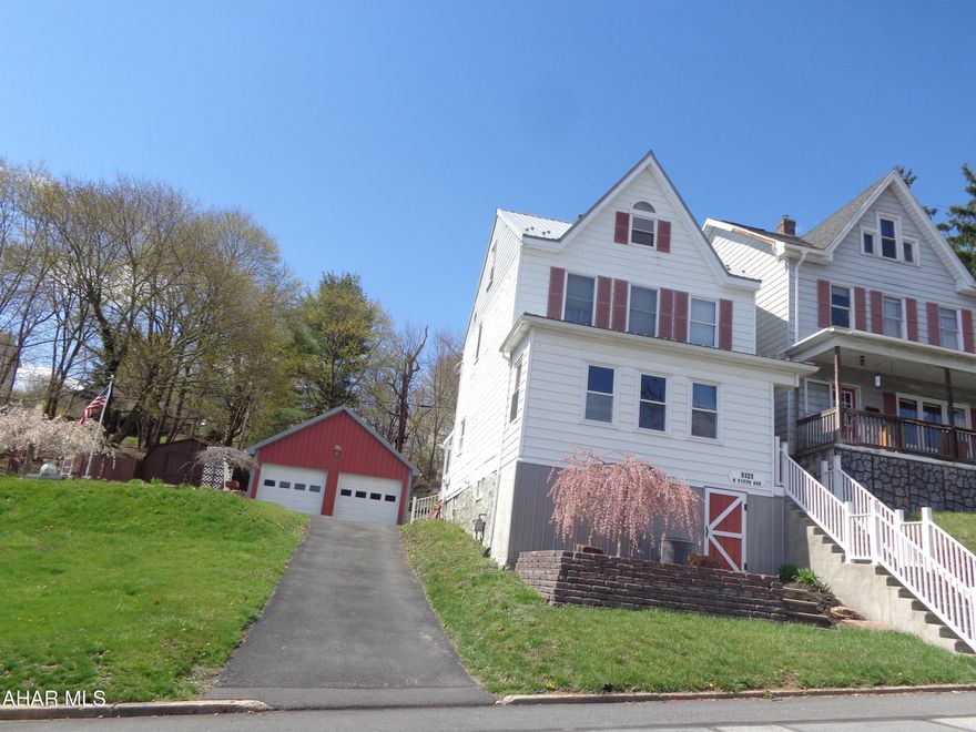 This charming & well maintained home is all that you have been looking for!  Situated on 3 city lots .  Beautiful updated kitchen and a sunroom.    The attic has 2 bonus rooms.  There is a  2 car garage with a loft and a shed.  This home is in tip-top shape!