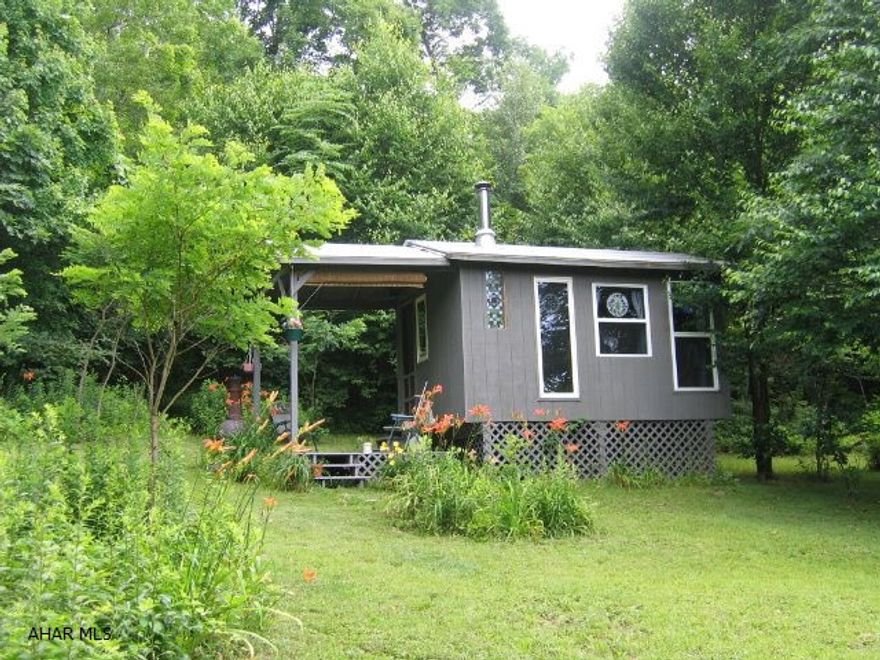 A beautiful 44 wooded acres with great views from the top! Small camping/hunting shelter with wood burner and stream on the property. Great buy for the hunter or getting away for some peace and quiet.
