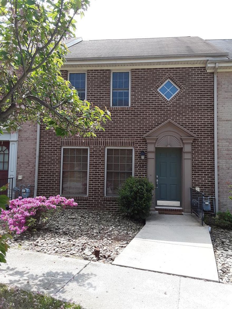 Holiday Hills Townhouse... This home is waiting for you to make it your own...living room with laminate floor and closet, dining room with sliding doors that lead to the deck with great view, kitchen with all appliances and 1/2 bath...2nd floor has 2 bedrooms with carpet and 1 full bath...lower level has a large family room with bar, laundry area, gas heat, central air...back patio, fenced yard, paved drive way and low maintenance...listed for $147,500.