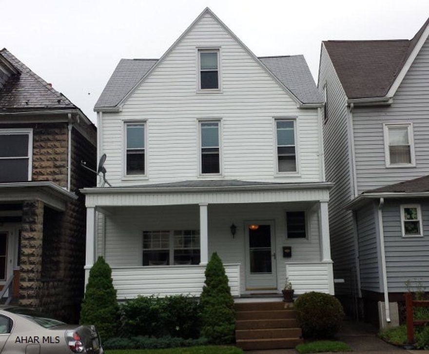 Updated 3 bedroom home with first floor laundry, updated kitchen breakfast bar, gas range, dishwasher, new roof, new front porch with composit decking.  Fenced yard, small patio area, hot water heat.   Thermo pane windows on a pretty block.  Move in ready for only $74,900.