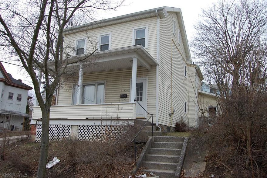 Large 3-4 bedroom, 2 bath home situated on 3 city lots.  Fenced back yard with 2 car detached garage.  Ton's of potential in this home, oversized rooms and plenty of closet space.  Minutes from UPMC Altoona, Penn State Altoona campus and downtown Altoona.  Call today for a showing.