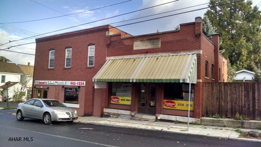 All brick building with so much potential!  Partially finished 2nd floor.  All brick exterior with newer roof and updated electric!