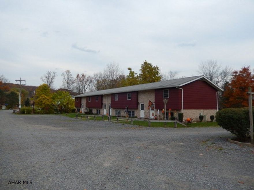 48 unit apartment complex in Antis Township.  The lot size is 30+  acres, only approximately 10 acres is developed leaving 20 ares for future sites.  Tenants pay all utilities except sewer.  Each unit offers 200 amp electric.  This 48 unit housing complex has 2 and 3 bedroom townhouses.  The property has a warehouse that contains 8 bays ansd second floor workshop with storage areas.  Included in sale are a Ford F250 with plow and salter, a John Deere 450 type crawler/loader, Case 580 Mdl backhoe, dozer,  dump truck, riding mower, various lawn equipment and building supplies, 5 refrigerators, 2 electric ranges, and more for a turn key operation.  Qualified buyers only can contact for more information.