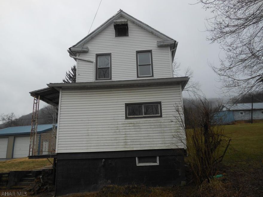 This is a home located just outside of Huntingdon. The property has a large 0.52 acre lot with a newer 2 car steel building garage. The garage is a 28x32 building with concrete flooring. The house features a laundry room, bedroom, full bath, dining room, kitchen and family room on the first floor. The second floor has two bedrooms and a captive bonus room. With some custom touches, this house could be your home