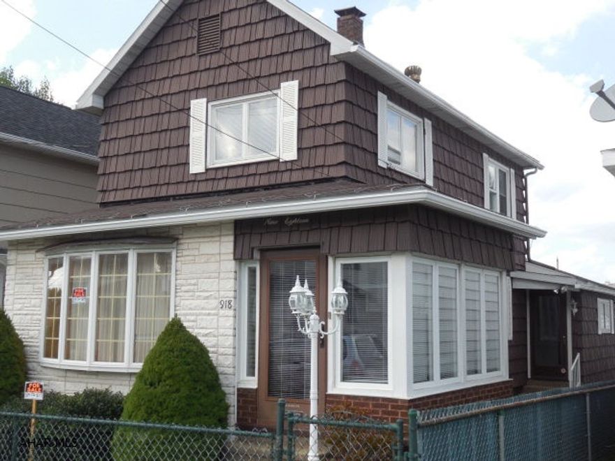 This home is ready to go!--with a large living room. Freshly painted, new carpet, custom drapes & a security system. The 1st floor is equipped with a ADA Bathroom. The yard is fenced and the property has a 2 car garage with electric and openers. New sewer lines are in and ready.
