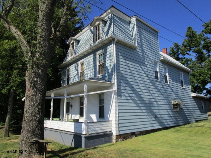 Two-story home situated in the Rainsburg Borough. Home contains approximately 2,128 square feet, features five- bedrooms, two baths, large living room, kitchen, dining room and first level laundry. Some original handmade wood pieces still remain at this home, including trim, shaker staircase, doors and living room mantel. Peaceful setting with nice views of the countryside. One-car garage, picnic area on the back of the home and level lot. With a little sweat equity this could be an awesome home!