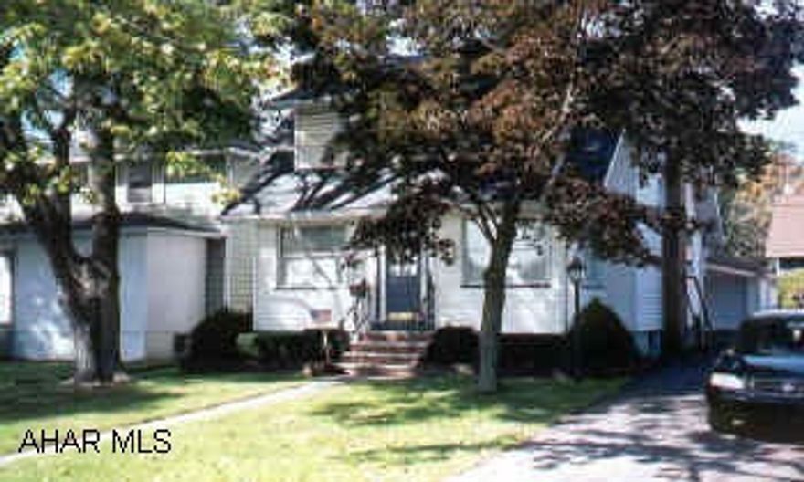 This home offers large bedrooms, beautiful hardwood floors, brand new kitchen, new roof, finished basement, gas fireplace, central air.  Ready to move into.