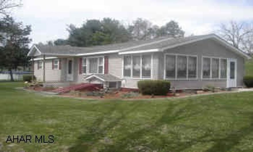 Completely remodled 3 bedroom vinyl home situtated on a quiet 2.5 acres only 5 drive from town.  Features oak kitchen cabinets as well as a wood tiled floor.  Also a spacious sunroom and above ground pool as well as a 3 car detached garage.