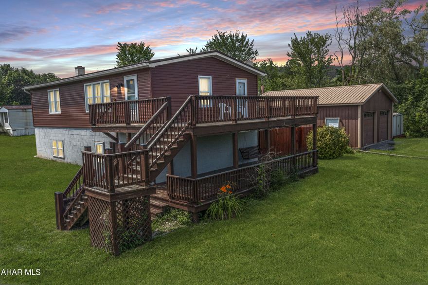 A little TLC goes a long way a this home in Duncansville. Tucked away on a private lane right across from the Dollar General Store off Old 22.... You'll find this 3 bedroom 2 bath home... with a one car integral garage and side double deck. There's also a detached two bay 24 x 34 foot garage with a workshop. If you enjoy working on cars, you can do it here! The garage is also heated with a wood burner. The house has so much potential with vaulted ceilings in the living room... and a bonus room on the first floor with an oil burner plus a first floor half bath. Double doors walk out to a screened in patio and fenced in backyard- all on a corner lot! The house has a newer roof and mechanics, plus central air! The seller will consider including many of the items in the home, for the right price! House being sold as-is. Please note: Some photos include virtual cleaning to give buyers a better idea of what each room looks like without personal items in them. 3D Matterport virtual tour available with this listing! Contact listing agent for your exclusive link!