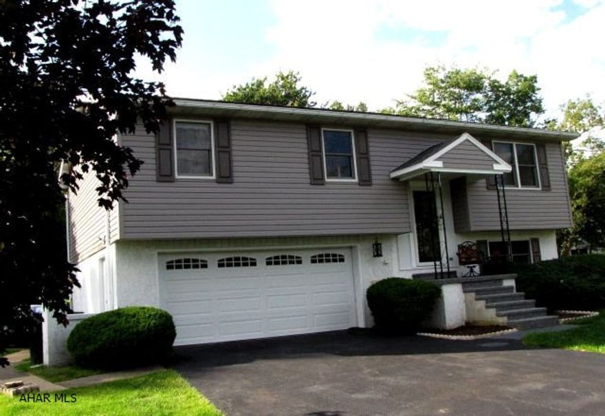 Here is your dream house! Paved driveway to a 2 car garage, large fenced in back yard. Walk into a freshly painted house with 2 bathrooms renovated. Large kitchen, dining room, living room, and downstairs is a large family room w/woodburner. A sun room overlooks the backyard. This home has central air, very well maintained, clean and ready to move into. Convenient location, Hollidaysburg School District.