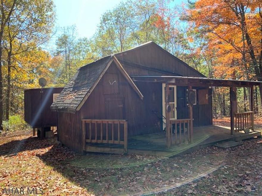 This little cabin is located in paradise. Sitting on top of the mountain away from the hustle and bustle. With gated access, this is a very private location. Pretty much surrounded by State Game Lands, this could become your next great hunting destination. Spend your evenings enjoying  the wide open sky at night and the wildlife by day. Nice views from the property. This little camp with 10 acres screams....'BIG BUCK'