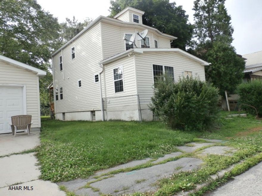 Motivated Sellers! Bring all offers !  Large fenced in corner lot. Double detached garage. In 2013 new vinyl siding and windows. New hot water tank. The kitchen is updated. 3 bedrooms and 2 1/2 baths.  House needs TLC  Conventional loan or a loan like an FHA 203K loan.