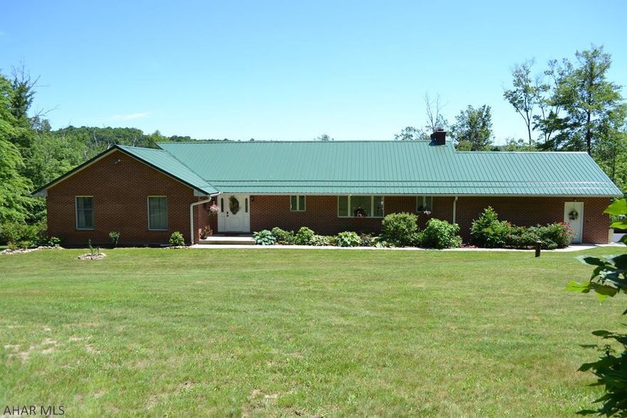 Stunning brick ranch in a picturesque Bedford County setting.  Nestled on a partially wooded 6.69 acre lot, this home has total privacy.  With easy access to I99, I68 and the PA turnpike, this property is also just minutes from Historic Downtown Bedford.  Maintained impeccably, this 3 bedroom, 4 bath has an updated kitchen with granite counters, porcelain floors and stainless appliances.  The bamboo hardwoods are filled with lots of natural light in the spacious living and dining rooms and give way to the wrap around deck spanning the entire length of the house.  The master suite includes full bath and walk in closet along with private deck access. Generously wide ADA accessible hallways and closet space galore.  Walkout basement is partially finished as well as a 2 car attached garage.