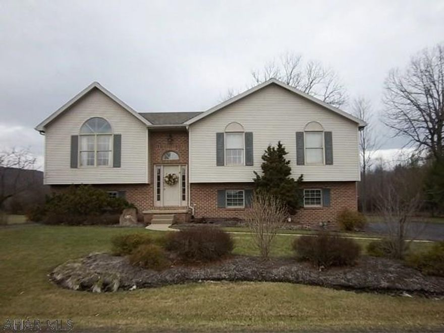 Move in ready home with lots of storage.  Nice location and flat lot.  Features central air, two car heated garage, remote controlled ceiling fans, fireplace in family room and central vac.  Very bright and cheery with room for everyone.  Take a look today before it's gone.  Call listing agents for private tour.