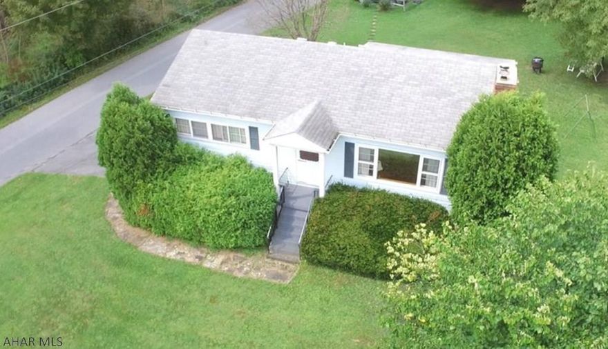 This charming, well maintained home is wonderfully located between Bedford and Cumberland.  If you are looking for peace and quiet, this home is fabulous.  Enjoy lovely landscaping from the screened in porch.  Kitchen opens onto a dining room.  All hardwood floors throughout on the main floor.  The lower level offers a walk out basement, rec room, extra bedroom, and workshop.