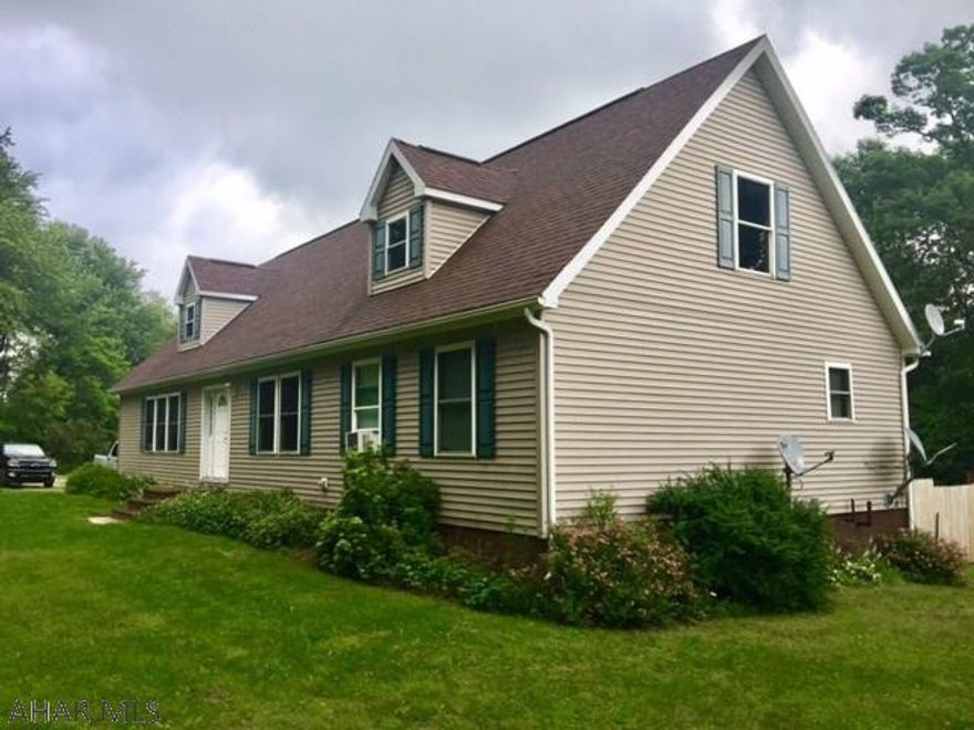 A rare find with this cape cod situated on 10.2 private acres.  At 1800 sqft of main floor living there is room for everyone in the family.  3 bedrooms 2 full baths, living and family rooms, large rear deck, oak kitchen, new low maintenance flooring and main level laundry.    Full basement with radiant floor heat would make a perfect area for an entertainment space and the 2nd floor has endless possibilities. Outside there is room to explore on trails, a stream, fire pit, detached building to hold all your toys and much, much more!