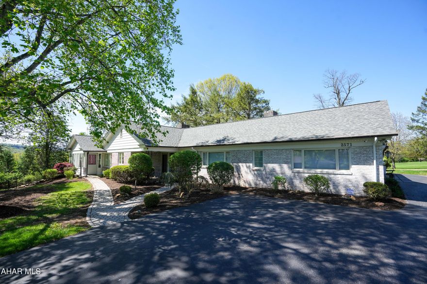Location, location, location for this classic brick in a very desirable location in Hollidaysburg. Completely updated including a new roof 2 years ago. Beautiful Eat-in kitchen with Tiger leathered granite countertops and black SS appliances. Rustic Maple Hardwood floors throughout most of the home. Cozy Great room with gas fireplace and beamed ceiling. Private covered deck to enjoy the lush landscaping and views.  Beautiful Recently update Primary suite with custom bath and walk in closet with custom built-ins. There is a second bedroom with its own bath. Did I mention the three car garage.....This home has too many features to list....call today for your personal tour.