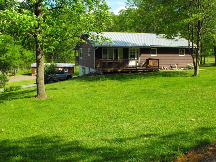Wonderfully quiet 3BR/1.5BA Raised ranch in Hesston Pa. Bathroom has tongue and groove pine with a handmade matching mirror, new carpet in the living room, newer pellet stove, flu, furnace, central air, windows and roof. Large basement that is partially finished. Property has approx. 3 acres fenced for animals. A fenced riding arena for horses or corral for other animals. There is a detached one bay garage with a furnace and a double carport perfect for boat or RV parking. 10 mintes away ro Raystown Lake, this property is a must to check out!