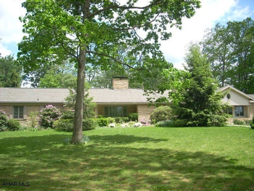 Large stone & vinyl rancher in secluded location.In-ground pool & bath house(not used), family room with gas-fired woodburner & heated floors! Sun room with fireplace & heated floors!