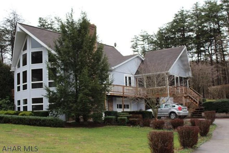 Tucked away into the woods, on a private drive, this beautiful home awaits. Although private it is also less than 30 minutes from Shopping, Restaurants, and Raystown Lake (Seven Points). The Windows allow for ample amount of natural light and from the inside provide a serene environment while looking out. The property also includes a garage and an out building turned wood shed. This home is a perfect Vacation house or full time family home. Schedule your showing today!