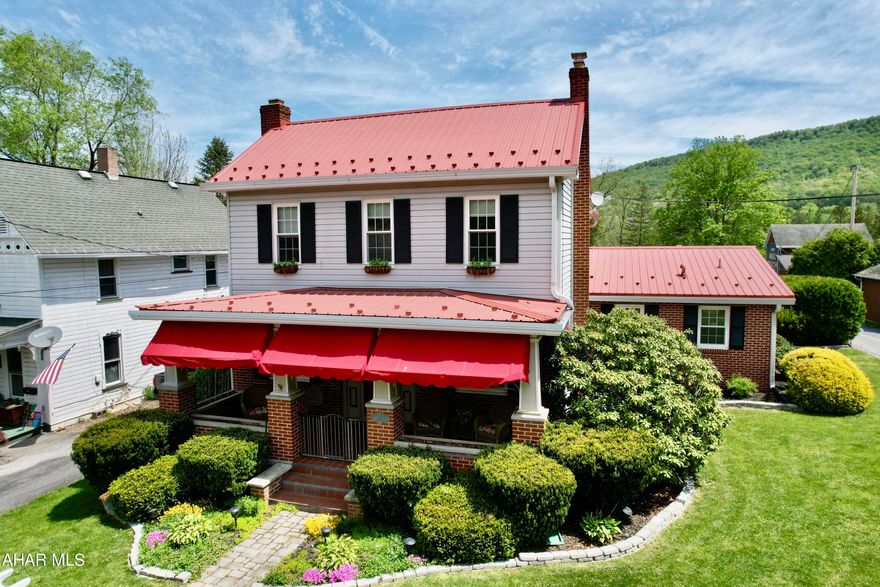 Come and see this enchanting Colonial home.  The manicured and landscaped front entrance with the custom awnings welcome visitors.  The living room has a wood fireplace with built-in wooden shelves.  The kitchen is open to the dining room making entertaining easy.  3 bedrooms with a newly renovated full bath on the second floor.  Custom built-in accents of character can be seen throughout this home.  The home wouldn't be complete without a first floor laundry and full bath off the attached 2 car garage.  The private backyard contains new patio, pergola, landscaping, black fence with gates surrounding the back yard, and a privacy fence between the neighboring house.  There is ample parking with the circular driveway and private parking off the back alley giving room for parking a camper, trailer, boat or more.  Lets not forget the 2 additional sheds for storage, gardening equipment, or a play house.  Walking distance to downtown Bedford, adjacent Elks golf course, and the Heritage trail.  Short distance to I99, I70, PA Turnpike.  2 hours from Pittsburgh, DC, Baltimore, Harrisburg.