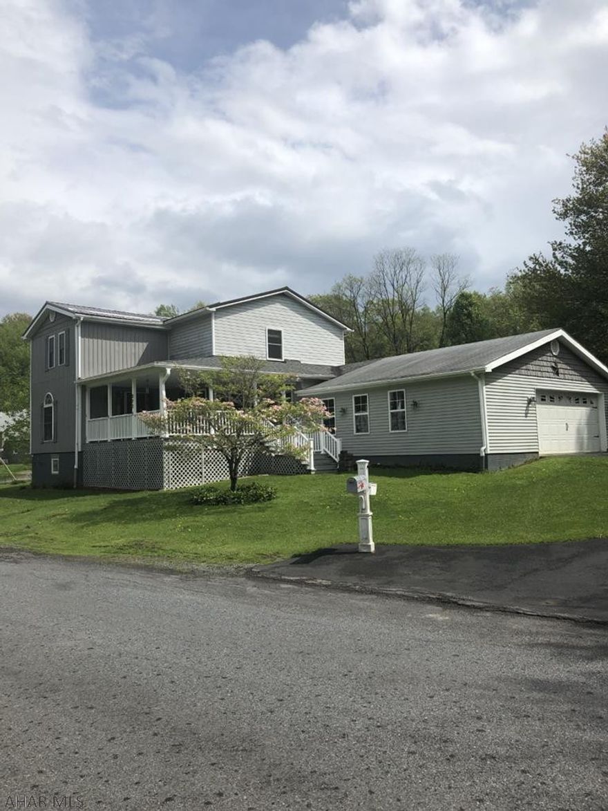 2 story vinyl sided 4 BR, 1 1/2 bath home on 1 acre