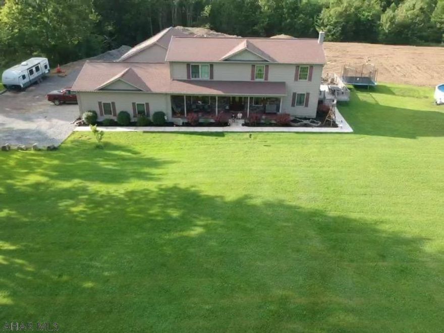 Truly a dream home - spectacular two story home built in 2011 on 4 acres.. Quality construction with 2x6 walls and 4 zone oil radiant heat. The home includes an equipped oak kitchen, large 26x28+/- living room, formal dining room, 3 bedrooms with second floor library, 2 baths. Jet tub in master bedroom bath. Interior walls were also insulated for a sound barrier. Full basement with 9'ceiling. Large rear composite deck and front porch. Above ground pool included. Attached 2 car garage with interior finish and a 3 year old detached 3 car heated garage with overhead storage.