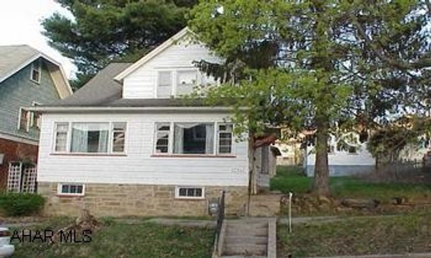 Needs TLC - Possible freeze damage.  Nice lot.  (2)  2-car garages.  "AS IS" Sale. Needs TLC.  Possible freeze damage.  Nice lot.  (2)  2-car garages.  "AS IS" Sale