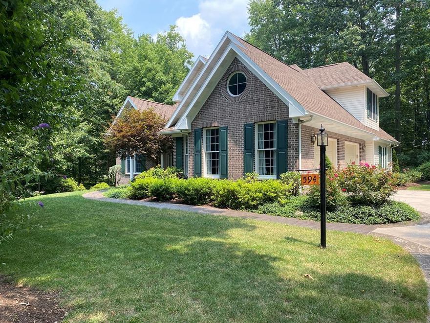 This is a home that wraps you in its warmth and joy.  Both interior and exterior design elements have been well thought out to incorporate the most wonderful flow.  Soaring cathedral ceilings, walls of glass, inviting indoor and outdoor spaces tantalize the senses and make this just a happy place to live.  Main floor master suite with walk in closet and gorgeous bath plus main floor laundry, lower level guest suite add to the convenience.