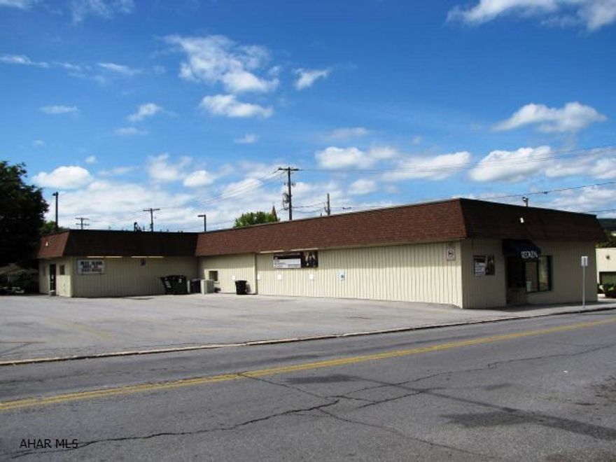 Corner lot in a high traffic location!5,216 sq. feet of well maintained building. Floor plan and room measurements are available upon request. Parking lot has 22 spaces. Previously known as Pruonto's Hair Design Institute, presently known as the Salon Professional Academy. Well maintained, one story, newer windows, 3 furnaces, central air, 3 bathrooms, 2 entrance doors, 13 rooms or offices, total of 5,216 sq. ft. Nice building, heavy traffic area.