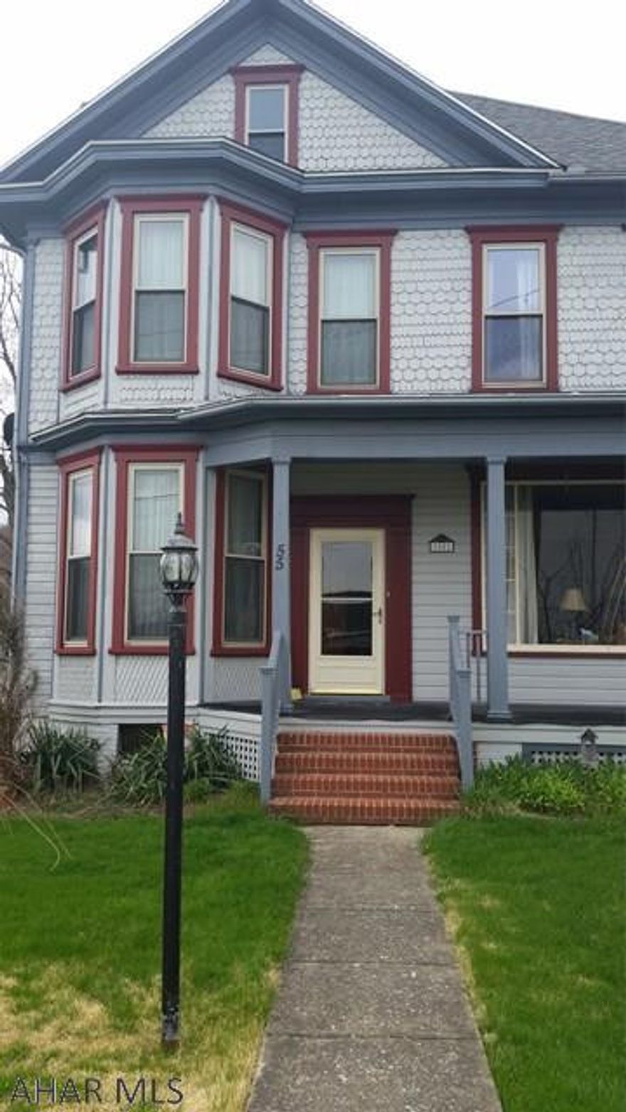 Beautiful large two story home with newer detached two car garage. Home has many of the old features that create that homey atmosphere while having the updates needed for modern living. Cherry kitchen with appliances included, large living room. The formal dining room has great appeal and is also large. A first floor office with separate entrance and a laundry room with 3/4 bath add even more to this home. The second floor has 4 bedrooms - one with a walk in closet and one with a cedar closet - and a jet tub bath. The home has 3 porches and a balcony. The lot is landscaped with ornamental shrubs. Windows, furnace were replaced and 1st floor central air conditioning added.