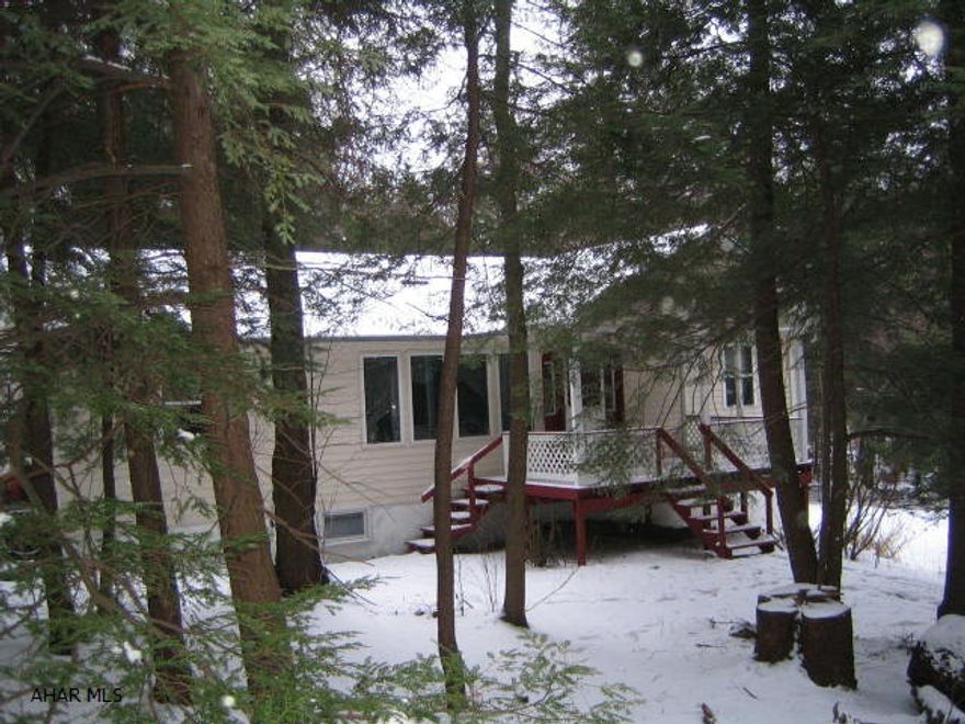 Secluded rancher on almost 5 acres, 3 bedrooms, 2 bath, many amenities, sunroom and more.