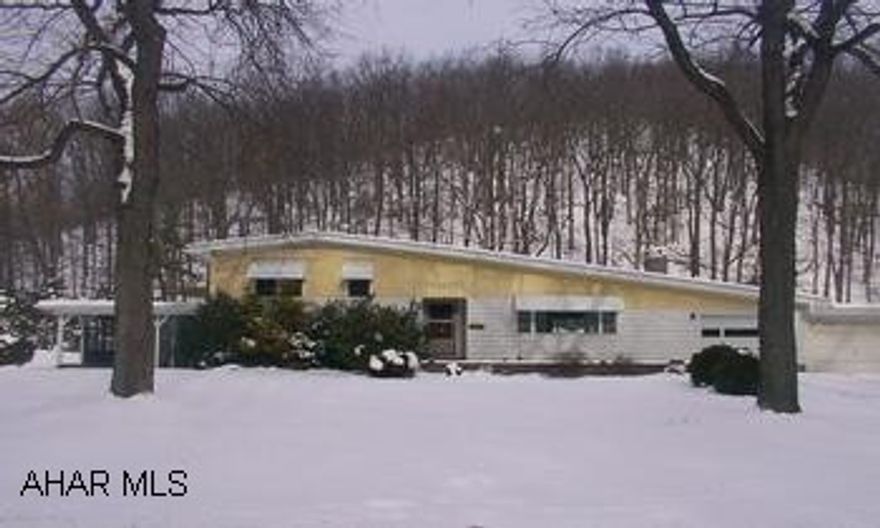 Unique multi-level home in beautiful setting near Reservoir Park.  Hardwood floors, wood fireplace, 2 family rooms, two kitchens, 3 year old furnace.  Needs TLC but could be a great home.  Motivated seller, will look at all offers! Unique multi-level home in beautiful setting near Reservoir Park.  Hardwood floors, wood fireplace, 2 family rooms, two kitchens, 3 year old furnace.  Needs TLC but could be a great home.  Motivated seller, will look at all offers!