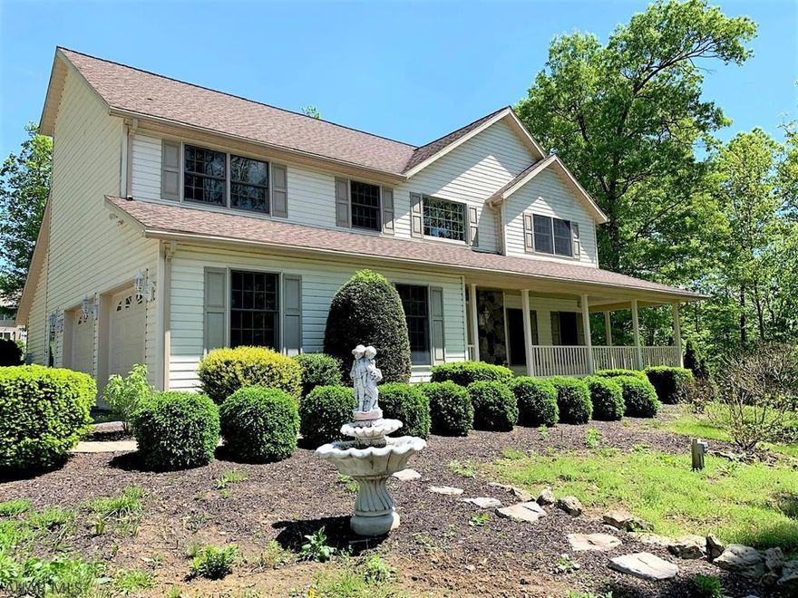 Well-built and well maintained home in Ridgewood Heights Development! Double-story foyer w/ open staircase, living room, great room w/ vaulted ceiling and FP, sun room, kit. w/ granite counters & recessed lighting, generous sized dining room and 1/2 bath. Second story offering a master suite w/ dual walk-in closets & master bath, two additional bedrooms, full bath and a plus sized laundry room (could convert to 4th bedroom). 2-car finished and attached garage, 2-car integral garage, Oil radiant heat w/ 6-zones, central air, well and public sewer. Beautiful hardscaping including interlocking retaining walls, patios and walkways. Covered wrap porch, stone accent, paved driveways and shed. DOUBLE lot!! IMPRESSIVE property for the money!!