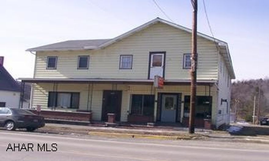 Shown by appointment only.  5 unit apartment building consists of 2 two bedroom apartments and 2 one bedroom apartments plus a commercial storefront and kitchen presently rented to a pizza shop.  Long-term renters.  Separate electric and new roof.  Oil hot water and electric heat.  Minimum $3000 commission.