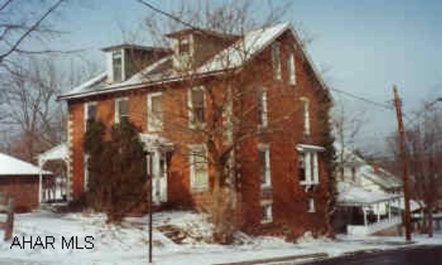 Brick home presently a duplex.  Could be converted into single family home.