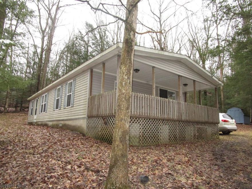 Are you looking for a roomy home for full time living or a camp close to the park for fishing or hunting?  This property will work for either.  Three bedrooms, two full baths, large kitchen, living room and dining room.  One floor living with the security of a gated community.  Get back to nature living in the woods, watching the deer and other wildlife.  Development is adjacent to Prince Gallitzin State Park / Glendale Lake and right down the road from State Game Lands 108.