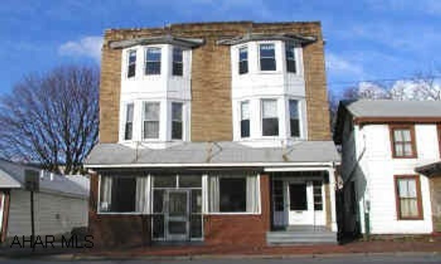 3 story frame and brick commercial building, Finished all three floors. Large oven and wall air-conditioning units stay.  2 gas ranges and freezers do not stay. Former St. Vincent DePaul family kitchen.  Second floor 5 finished rooms and bathroom.  Third floor 3 rooms and 1/2 bath.  2 gas boilers, 3-100 CB electric services.  2 car garage.  2 gas ranges and freezers do not stay.