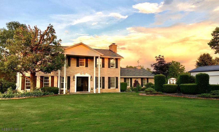 Ebensburg- Two story brick and vinyl  home on 3 acres The home is well maintained, updated and is move-in ready. 3-4 bedrooms with 2.5 bathrooms, attached 552SF heated garage &custom built 4 car detached garage /work shop w/ heat and plumbing drainage hookups in place. newer roof 2017, & stainless steel appliances.  DR w/ gas fireplace. Central AC upstairs. Hot tub spa on covered rear deck. Property features many varieties of young trees, plants &reseeding herb garden. Front landscape lighting & exterior lighting add to the night time ambience and appeal. Home security system is included, but service must be transferred.