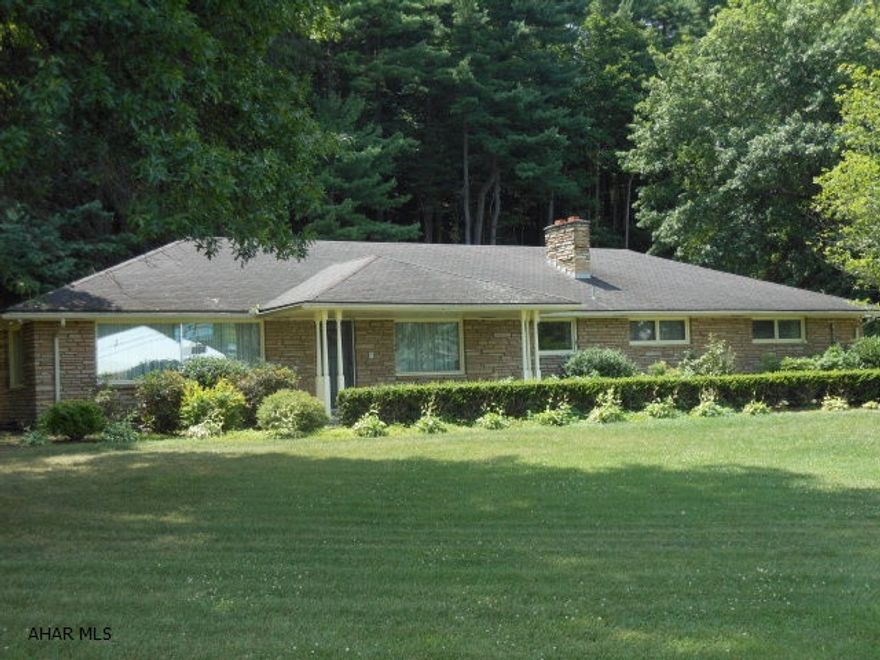 Custom built cut stone Ranch home on 2.02 acres. One owner. Large open living area, tons of storage, complete finished lower level-can be separate living quarters, custom oak panels in garage leading to LL stairway. Detached 2 car garage. Needs some updating but in good condition. Hot water baseboard heat - 4 zones - Electric fired.