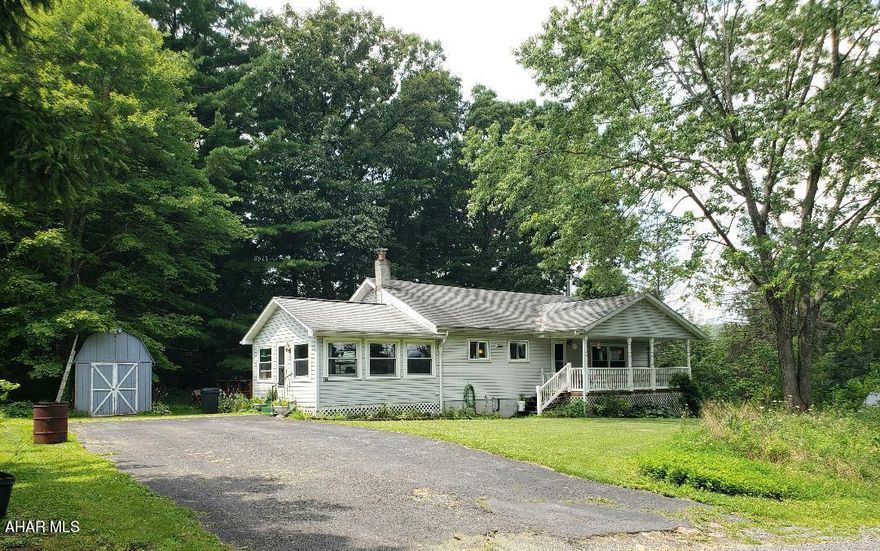 1-story 3-bedroom 1-bath vinyl sided home with sunroom, nice front porch & back deck on .54 acres. J-625