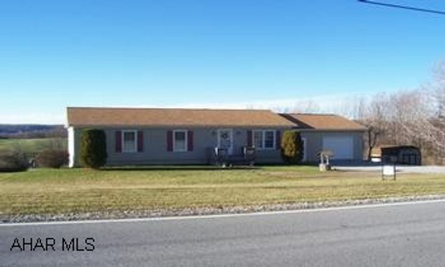 One story 18 year old vinyl sided with two zone oil hot water heat, 3 bedrooms, 2 baths, modern decor, appliances, garage, 1 acre. Nice home, sing on property.