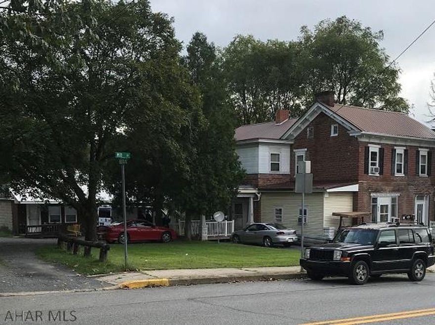 Great investment opportunity. Total of 6 units. Four in house (3 - two bedroom and 1 - one bedroom). Two in remodeled garage, both one bedroom. Current owner pays all utilities in house apartments. Tenants in garage apartments pay own electric and heat.