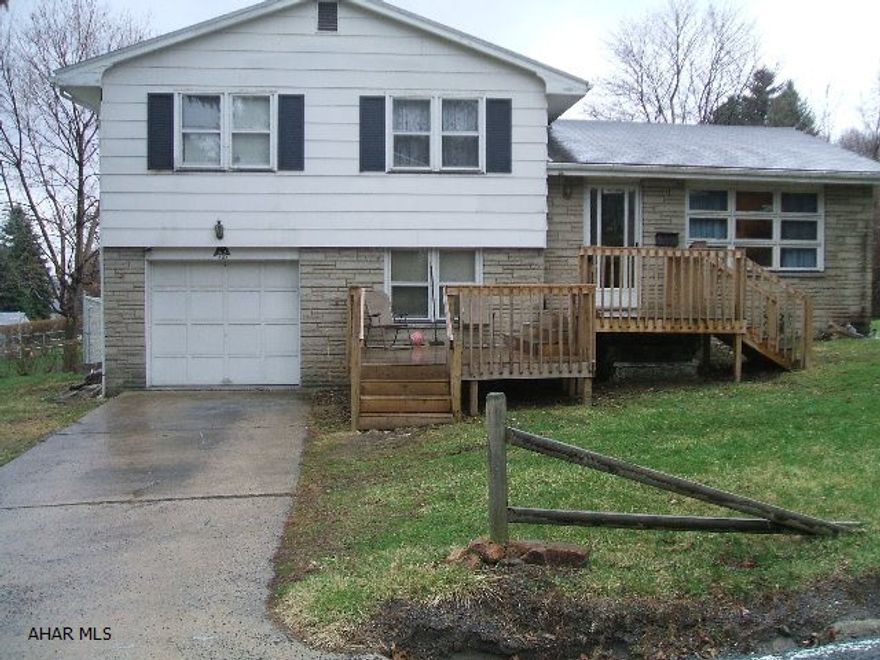 So much potential for this multi-level home in a great area.  Large lot with partial fenced-in yard.  3 bedrooms & 1 1/2 baths.  Large deck on front.  Needs a lot of TLC.