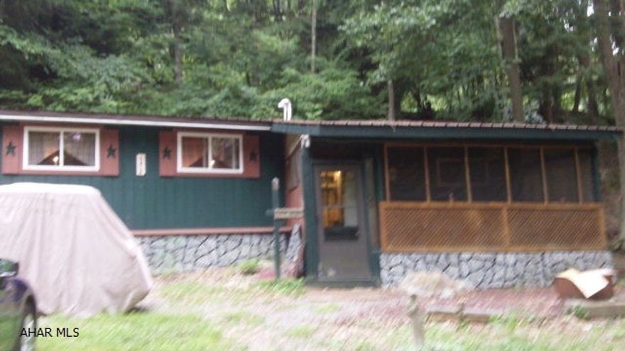 Although located in the campground this property is spacious and has some elements that make you think you are in a cabin.  The roomy kitchen with full size appliances and counter space makes you feel at home.  The large living room boasts laminate flooring and a nook for a desk.  You will appreciate the extra room in the bedroom with an attached bath containing an extra large shower.  A bonus room with a small stove and the screened in porch with a full size bed offer you more than enough room for the whole crowd.  Add to that the included washer and dryer - no running to the laundromat while at camp. Located in Glendale Yearound, a gated community with swimming pool, tennis/basketball/volleyball courts, and much more.  Close to Glendale Lake, State Game Lands 108 and Rock Run ATV Park