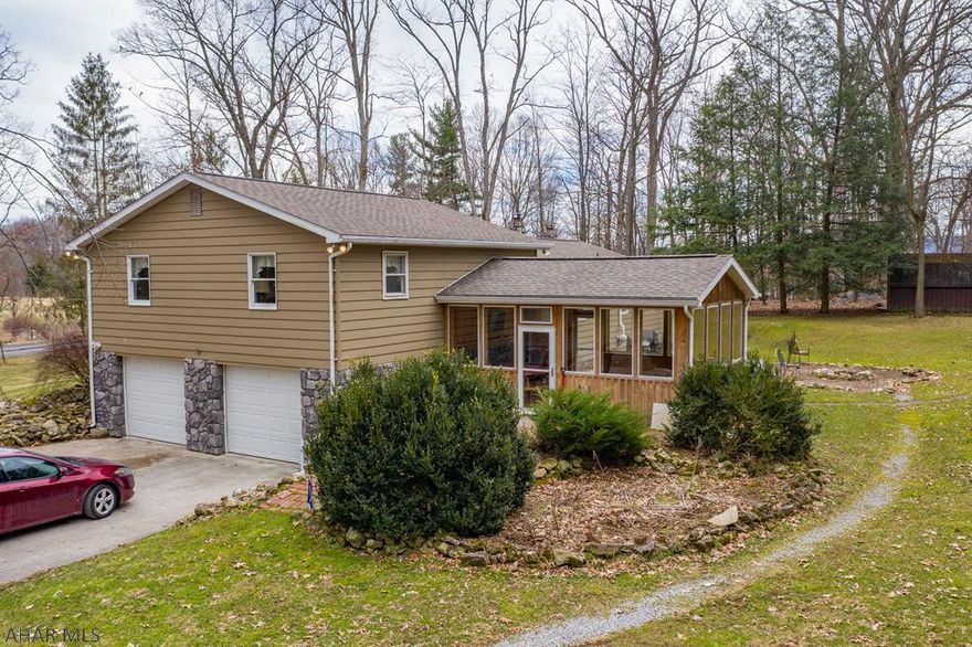 Country living in quiet, serene setting.  Large 28 X 28 living room addition over the oversized 2-car garage with work bench area.  Very nice well-kept 3 bedroom, 2 bath home.  Home has large inviting sun-room for 3 season enjoyment.  Want a large shed, a barn, and a pole building for livestock or horses?  It's here.  House has lots of storage space inside and out.  All this on 2 private acres.  And it's just minutes to Roaring Spring and Martinsburg.  Check out 3-D tour and schedule a showing.  Sellers are actively looking and must locate suitable housing out of state and would prefer at least a 60 day closing.
