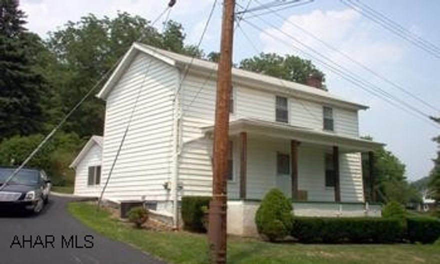 Three Bedroom Two Story with Rural Setting, but convenient to Retail, Highways, and both borough and city. Home has a large lot; three car garage with oil pit and plenty of storage above; two covered porches; large kitchen; and comfortable family room. Three Bedroom Two Story with rural setting in Hollidaysburg; convenient to town and city; large lot and three car detached garage, circular driveway on its other side; Two covered porches, central air, large kitchen and comfortable family room. 12' right of way exists on the westernly side of the property, and an easement has been granted along the front of the property for future sanitary sewer line.