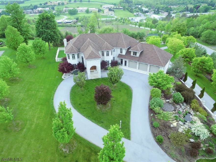 Check out this Majestic 5 bedroom 5 bath prestigious 7700 sq.ft.home!  It is a 'RARE OPPORTUNITY' to be able to purchase a home of this caliber and stature at this Price!  This home also features, a 2 story garage with a North entry from Duncansville, or a South entry from Hollidaysburg.  See the great views from the top of PineView Estates!!    This magnificent home spares no expense with its enormous master-suite featuring a double sided fireplace and balcony,a1st & 2nd floor laundry,  boasting 4 eating areas, 3 floors of Living space, and Geo-thermal heating system.....while setting on 2.64 Acres!